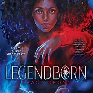 Legendborn cover showing a Black girl with natural curly hair surrounded by red and blue magic