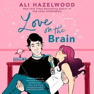 Love on the Brain audiobook cover showing a white man with black hair holding a white woman with long pink hair in his arms