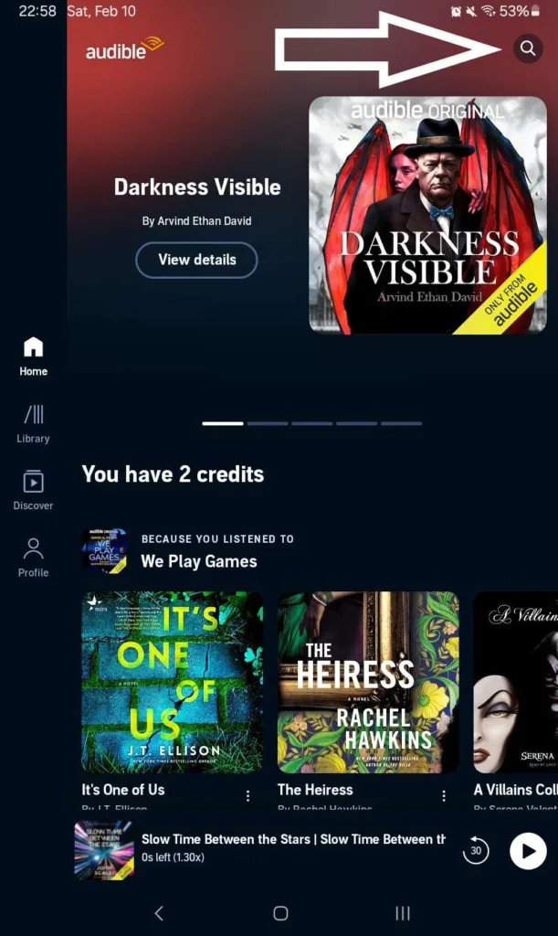 Screenshot of the Audible app with an arrow pointing to the magnifying glass in the upper right corner which opens the search bar